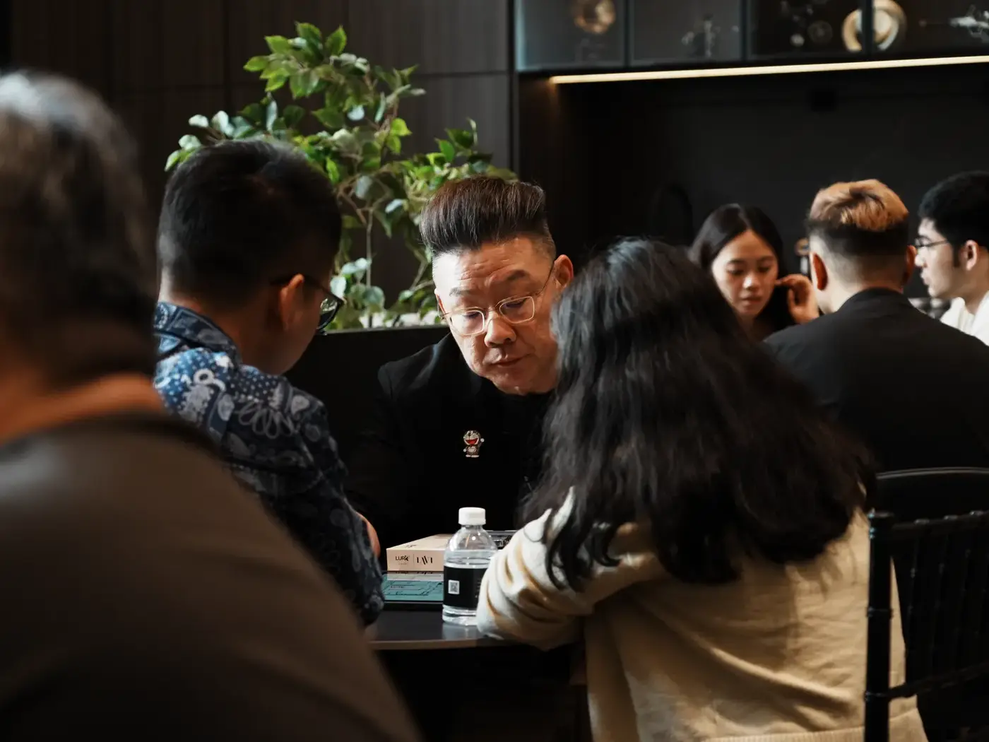 A full consultation table of homeowners and designers