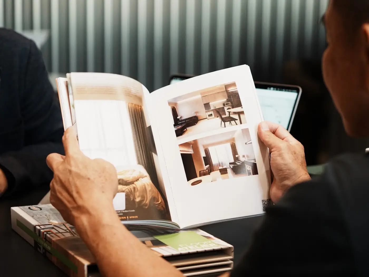 Homeowner flipping through a Design 4 Space design lookbook
