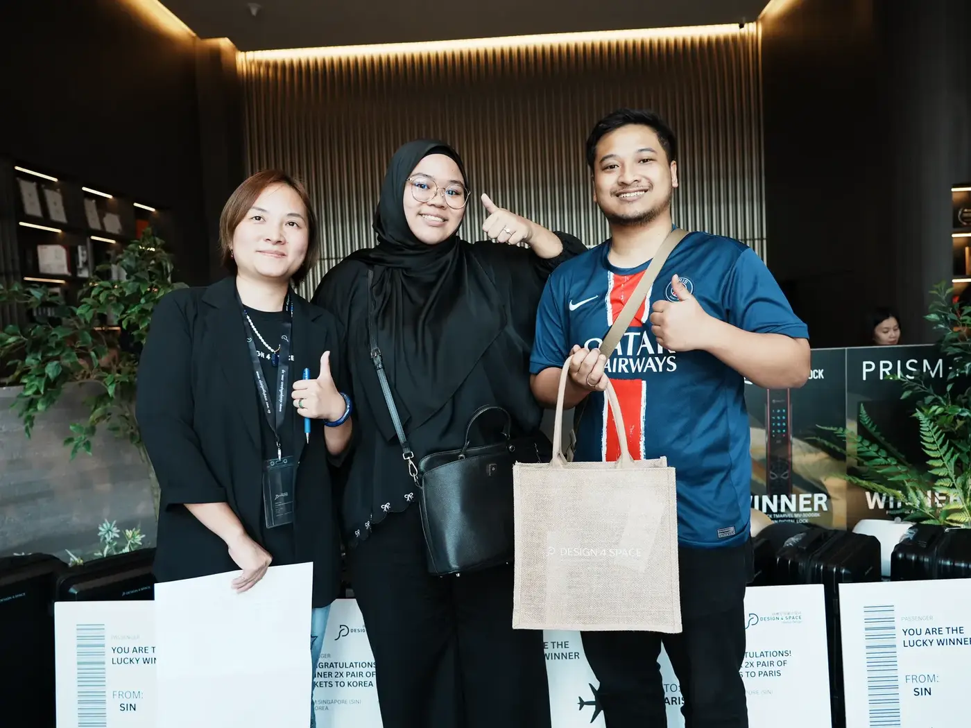 Prize winners posing with their goodie bags